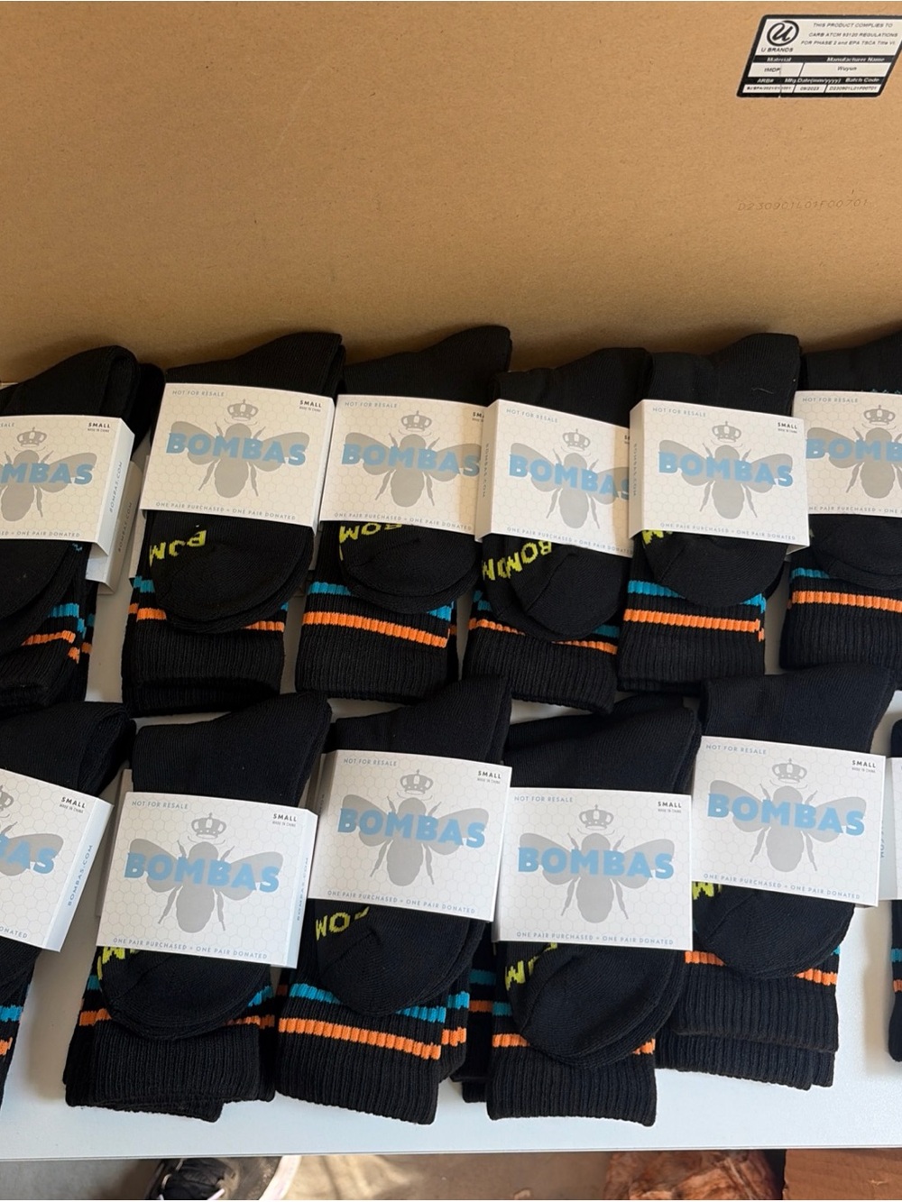 Bombas Black Crew Athletic Socks with Orange & Teal Stripe Accents